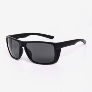 Angled view of black protective eyewear, featuring Safety Goggles Ansi Z87 with dark tinted lenses and integrated side shields on a white background.